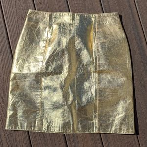 Gold leather mini skirt